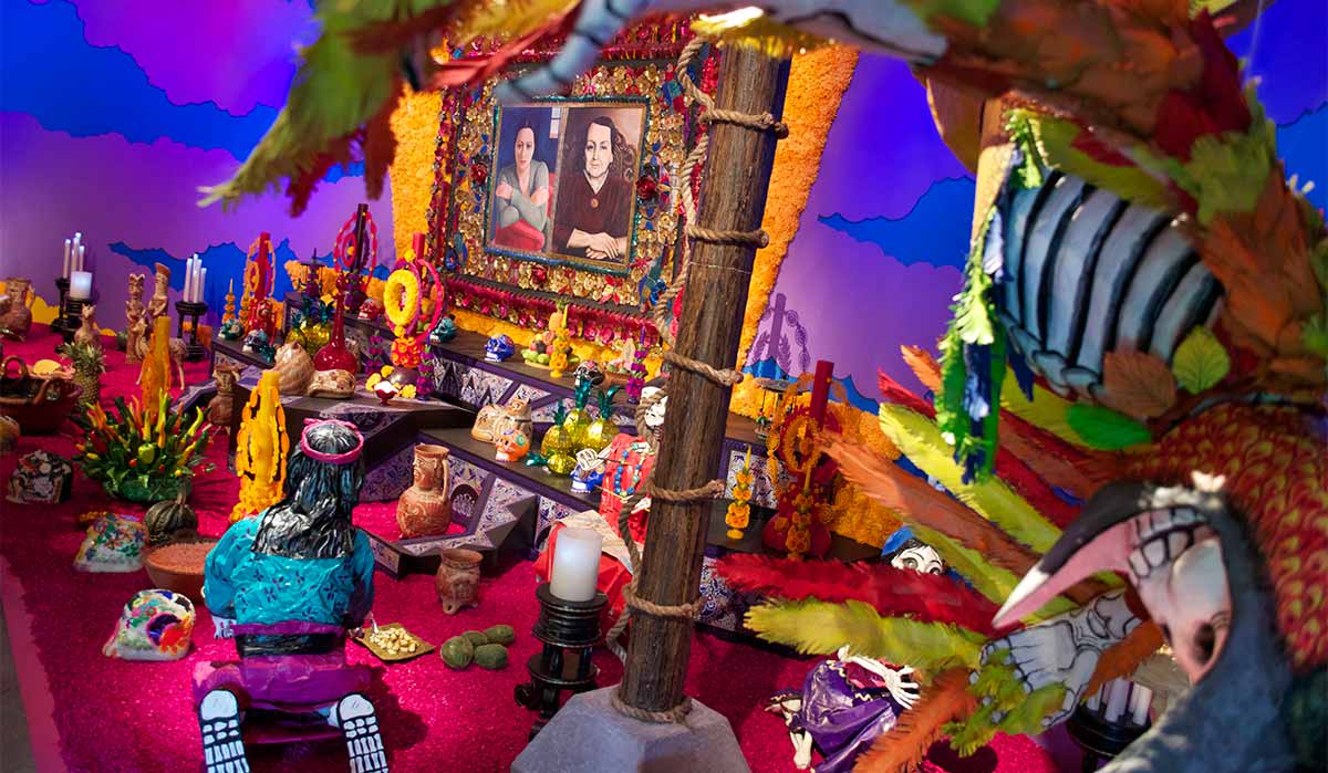 Day of the Dead, dia de los muertos altar with flowers and offerings